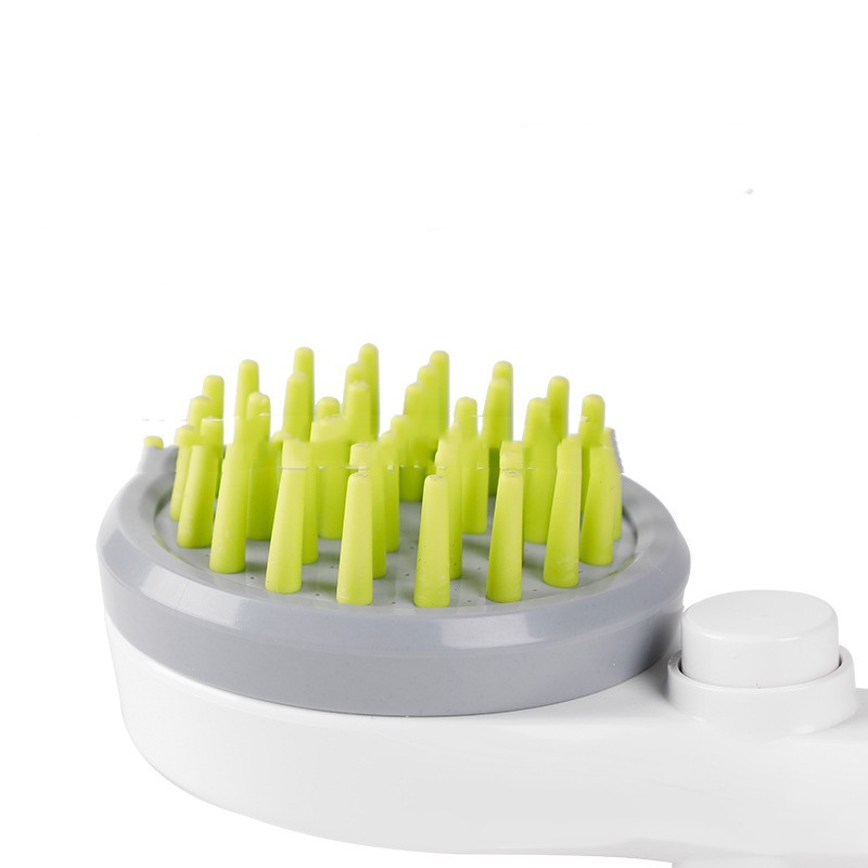 Close-up of 2-in-1 dog bath brush head with green bristles and gray base for grooming and bathing dogs.